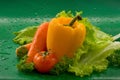 Vegetables - washed carrots, tomatoes, yellow bell pepper, lettuce leaves Royalty Free Stock Photo